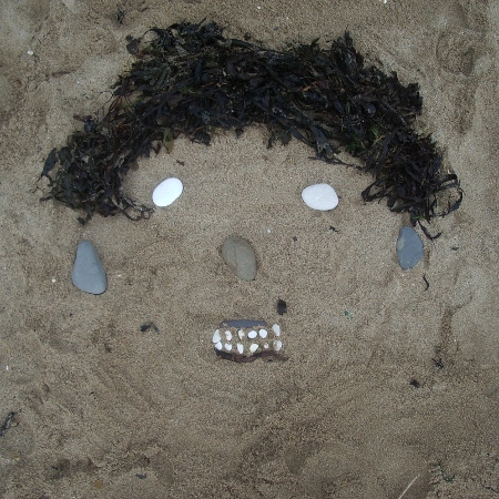 Sandface created from seaweed and stones on Bridlington beach